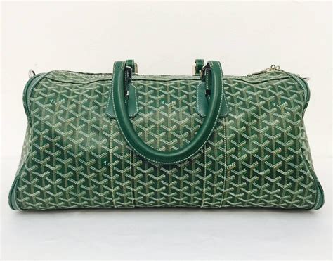 green goyard open duffle bag.